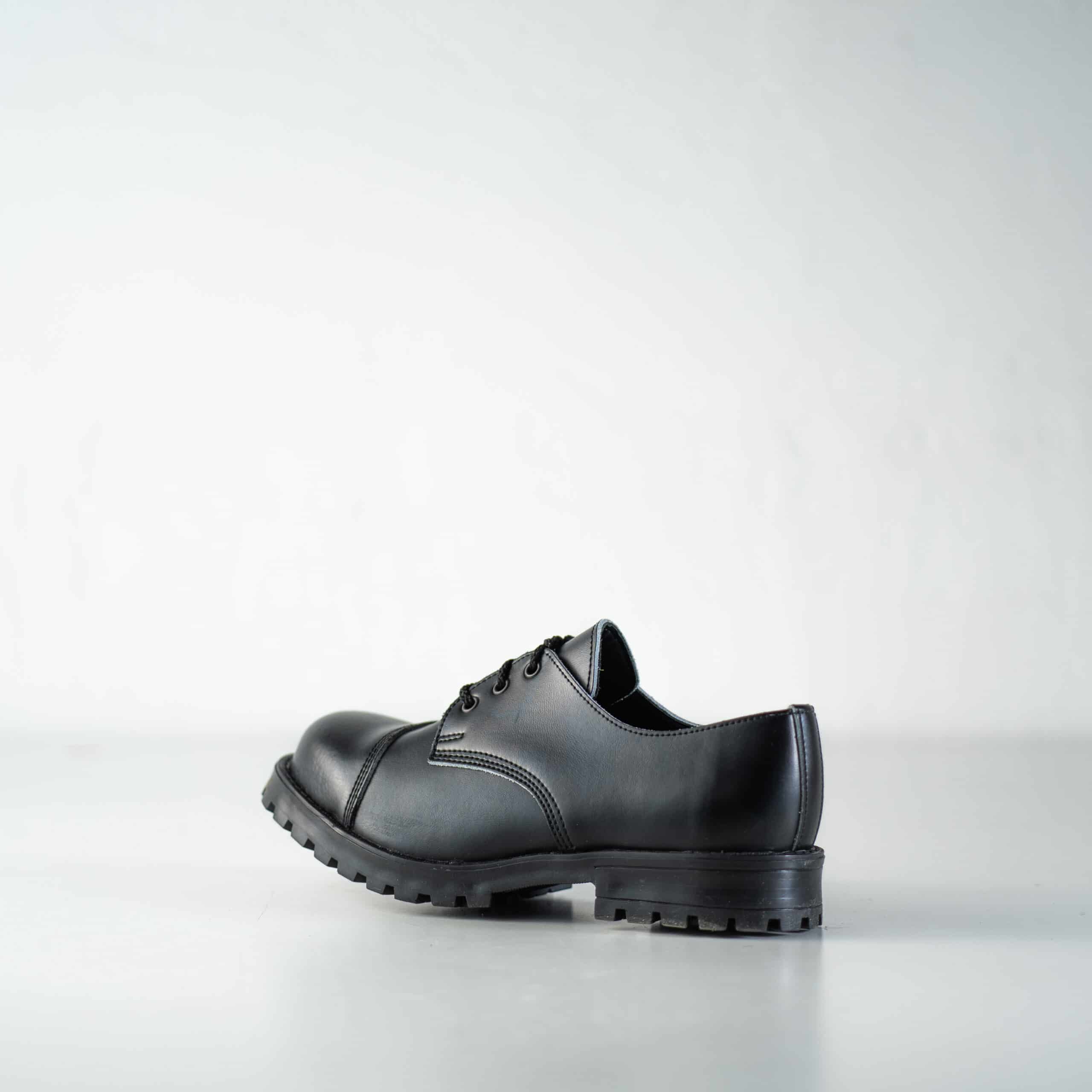 Bottines militaires en cuir noir fait main, vue de profil